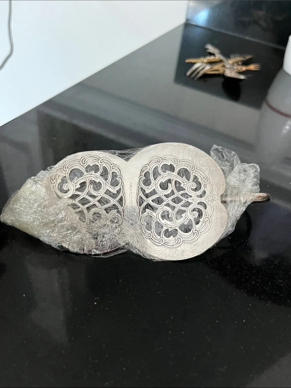 Vintage silver-plated cake server with finger loop.
